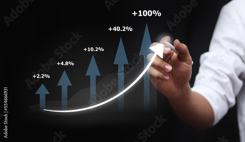 Businessman draw growth graph and progress of business and analyzing financial and investment data