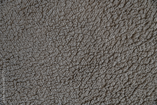 abstract background grey artificial fur on a knitted basis close up