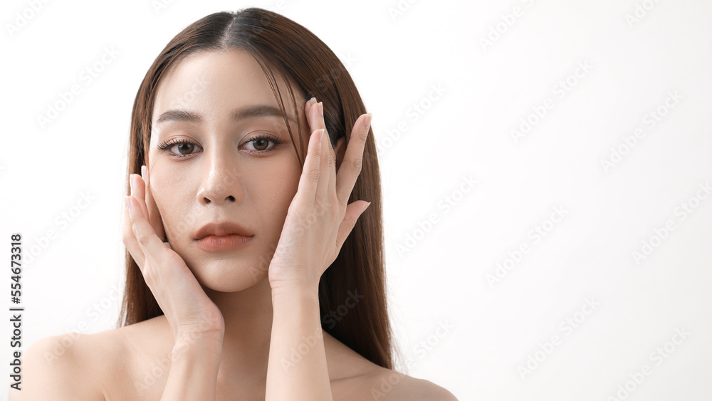 Beauty concept of 4k Resolution. Asian girl is touching her face on a white background. Beauty concept of 4k Resolution. Asian girl is touching her face on a white background.
