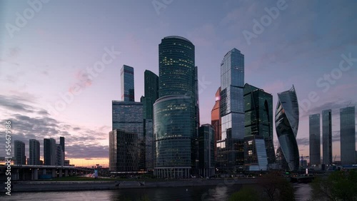 Moscow city glass skyscrapers, cityscape with sunset horizon, reflection in the windows.