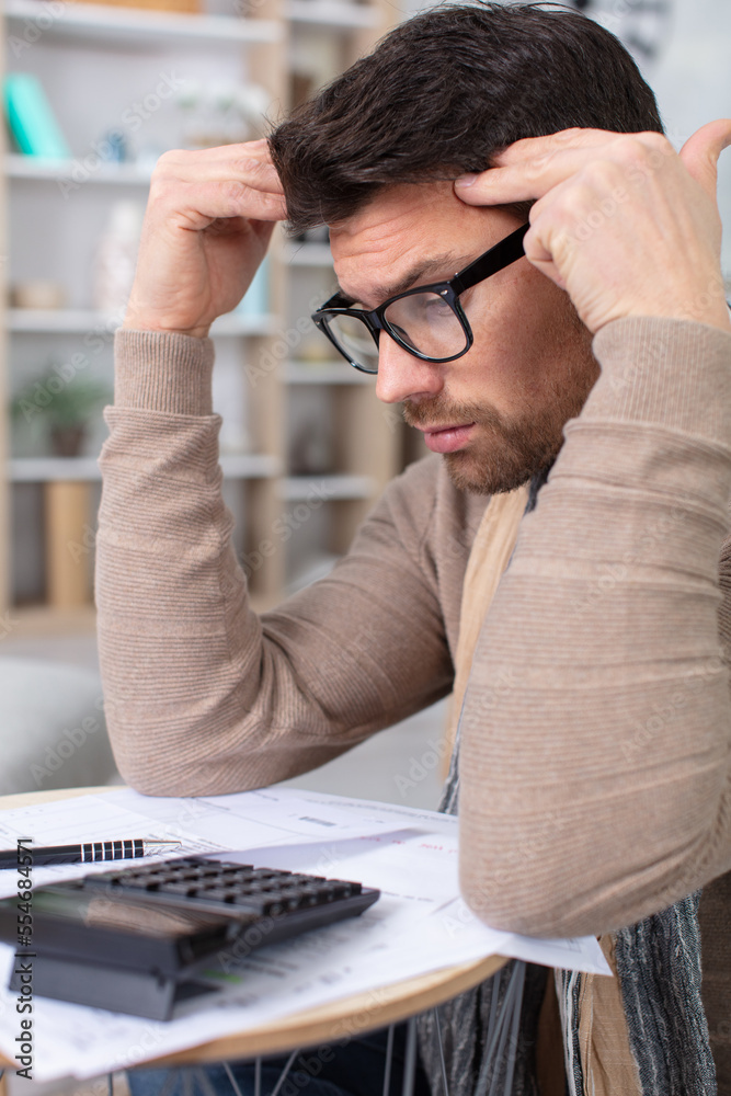 man troubled doing his home accounts man troubled doing his home accounts