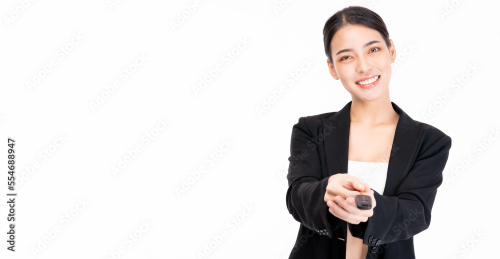 Happy young smiling satisfied successful Asian business woman in suit hold in hands giving car key with smile face isolated on white background and copy space studio portrait Sale female give car key Happy young smiling satisfied successful Asian business woman in suit hold in hands giving car key with smile face isolated on white background and copy space studio portrait Sale female give car key
