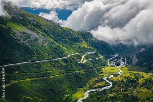 Alpine road with serpentines over the clouds, Furka pass, Switzerland