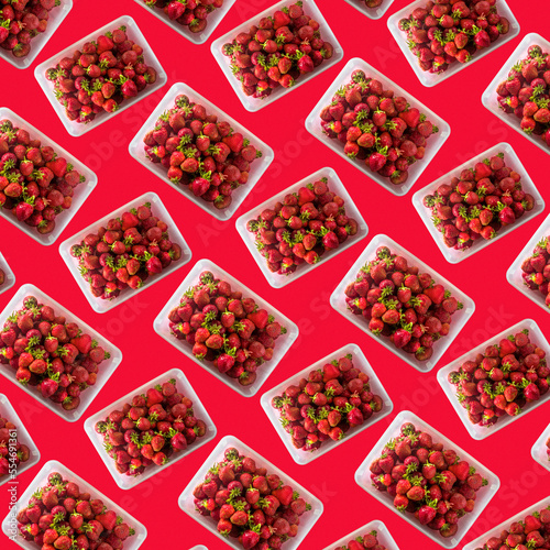 seamless pattern from a bowl with fresh strawberries and a red background