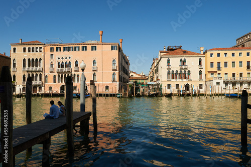 Couple Sitting on the pier in the city of Venice