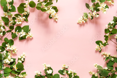Beautiful flower arrangement. Jasmine flowers, free space for text on a light pastel background. Wedding, birthday. Valentine's day, mother's day. Top view, copy space © Olena Svechkova