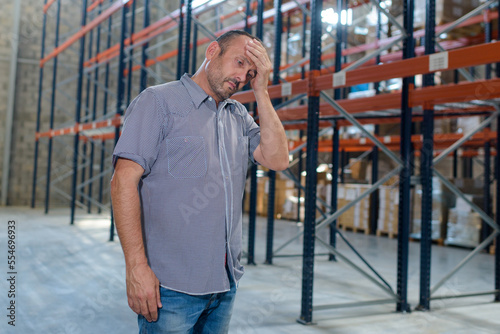tired man working in warehouse