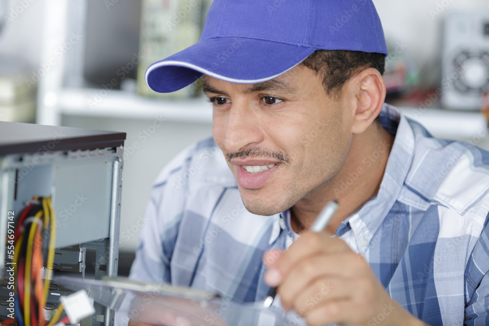 handsome computer technician writing notes handsome computer technician writing notes