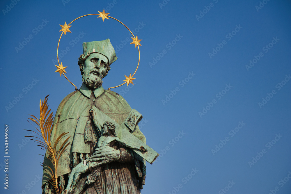 Statue of St. John of Nepomuk on Charles bridge, Prague. Czech Republic.