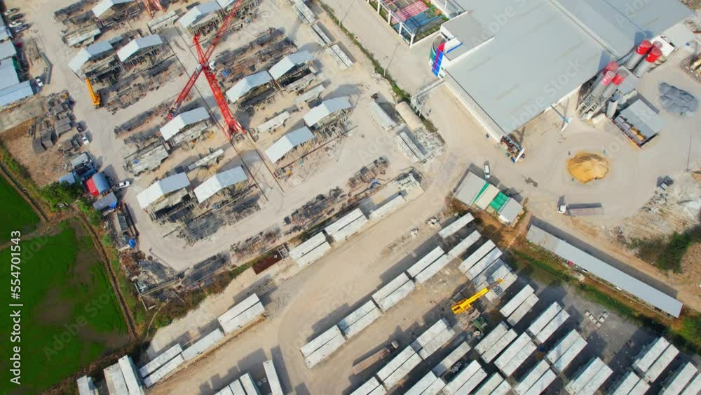 4K : Drones are flying over a many concrete material on outside storage yard. concrete and construction industry. logistics and infrastructure concept. southeast asia. aerial view footage
4K : Drones are flying over a many concrete material on outside storage yard. concrete and construction industry. logistics and infrastructure concept. southeast asia. aerial view footage