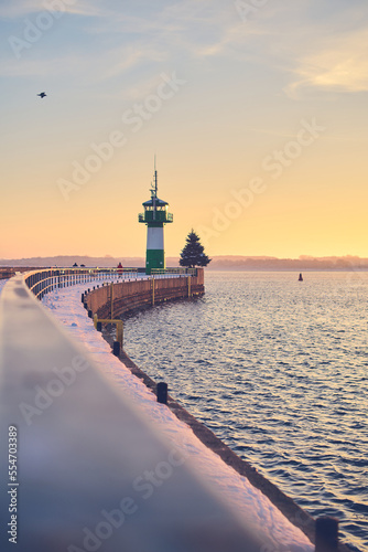 Lighthouse at Travemunde at the baltic sea in winter. High quality photo