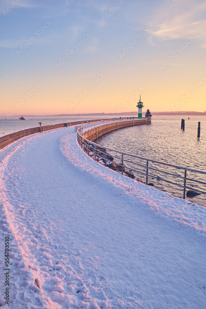 Walkway at the Nordermole Travemunde in winter. High quality photo