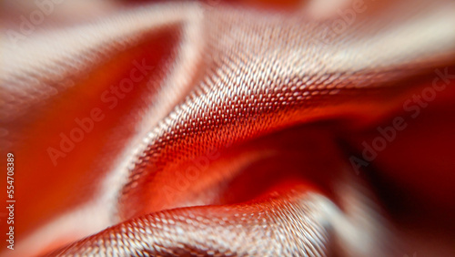 Macro photo of red satin fabric with glitter
