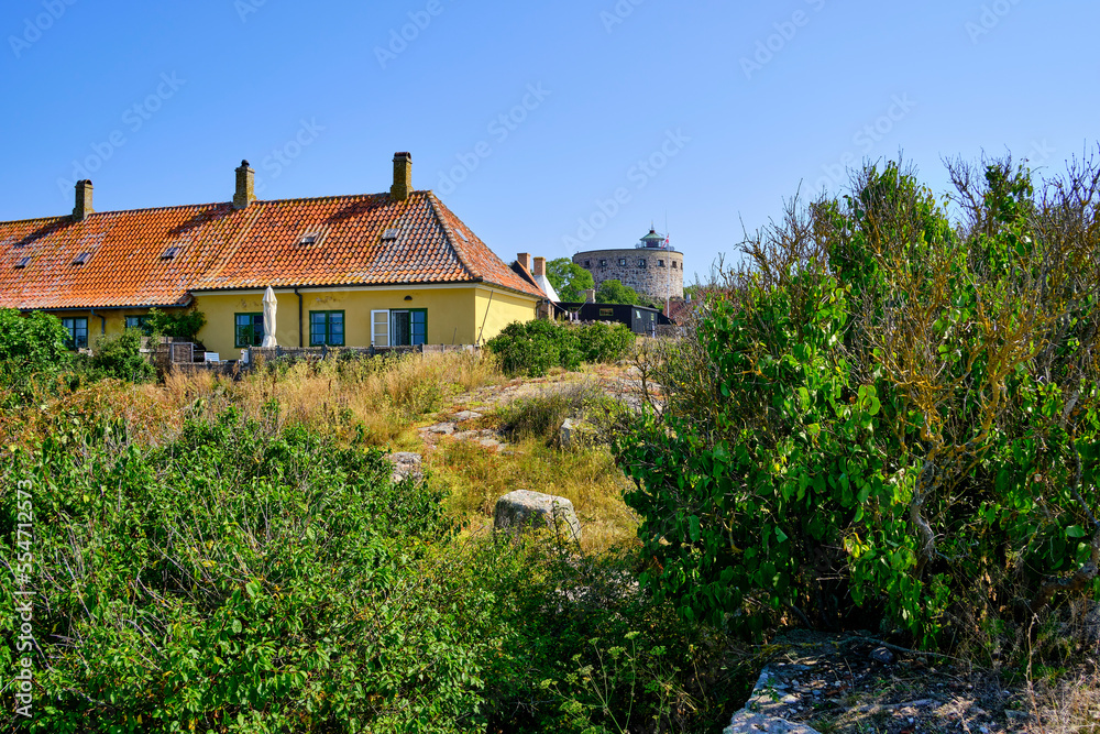 Out and about on the Ertholmen islands, wildly sprawling vegetation and historic structures on Frederiksö, Ertholmene, Denmark, Scandinavia, Europe.