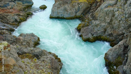 Canyon River with Pure Turquoise Glacier Water, Unusual Mountain Nature Landscape in Iceland. Shot in 8K Resolution 4320p photo