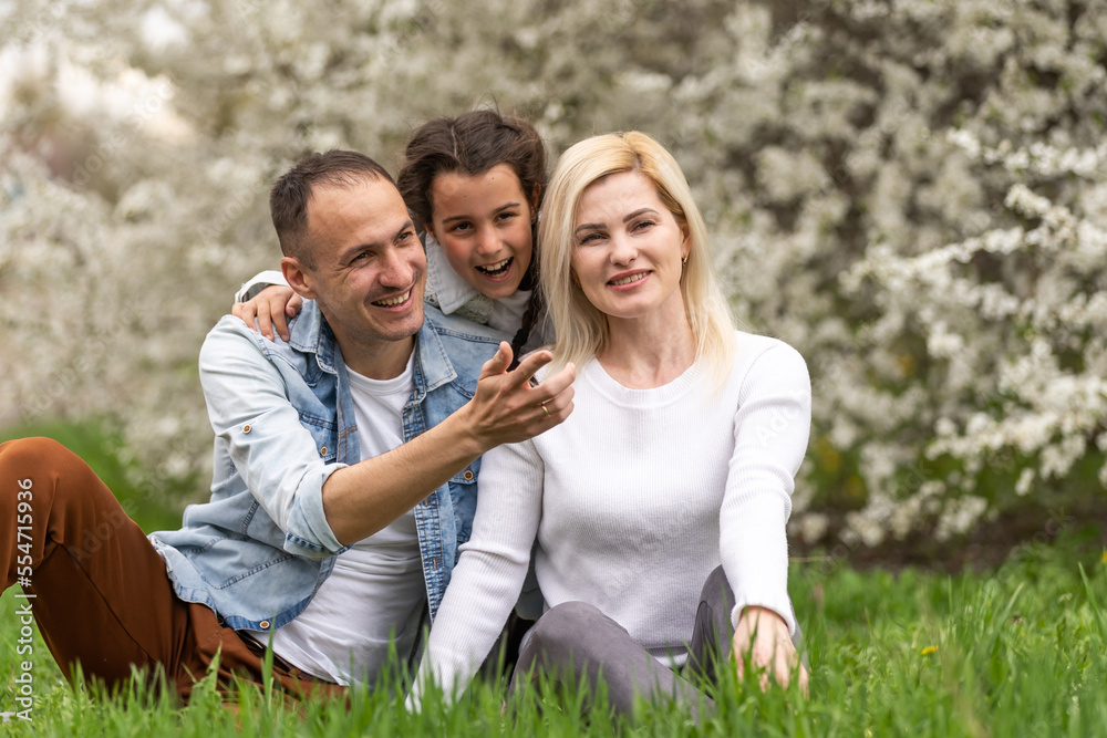 Family and small child outdoors in spring nature, resting. Family and small child outdoors in spring nature, resting.