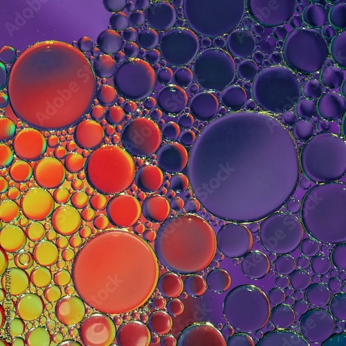 multi colored oil circles on the water, colorful background