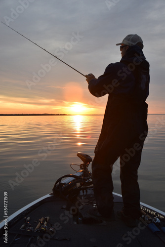 Angler fishing at sunrise