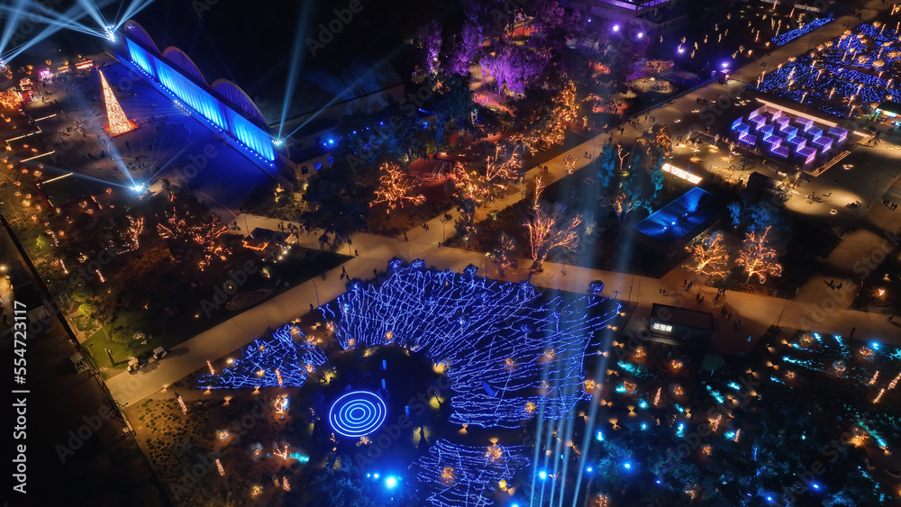 Aerial drone night distant shot from illuminated with Christmas lights futuristic Ellinikon Experience public Park an urban regeneration project and cultural center in Athens riviera, Attica, Greece Aerial drone night distant shot from illuminated with Christmas lights futuristic Ellinikon Experience public Park an urban regeneration project and cultural center in Athens riviera, Attica, Greece