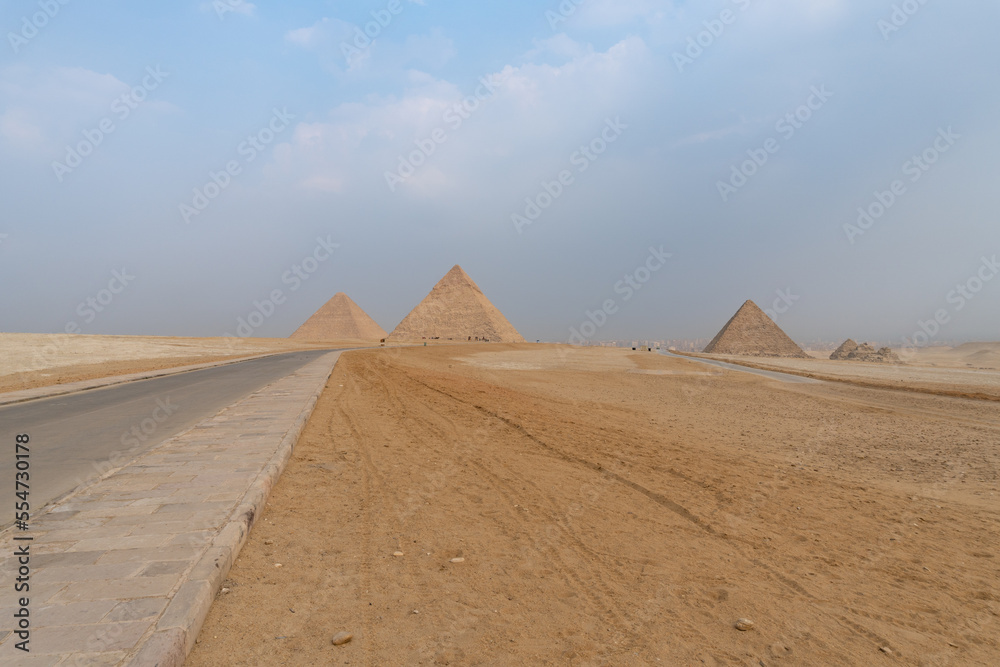 The three great pyramids of Giza seen from the road that passes next to them.