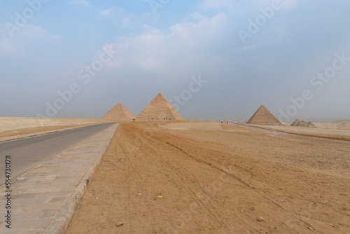 The three great pyramids of Giza seen from the road that passes next to them.