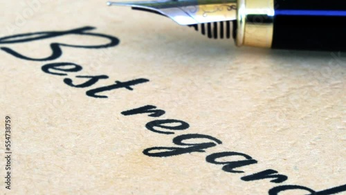 Fountain pen on best regards text dolly shot