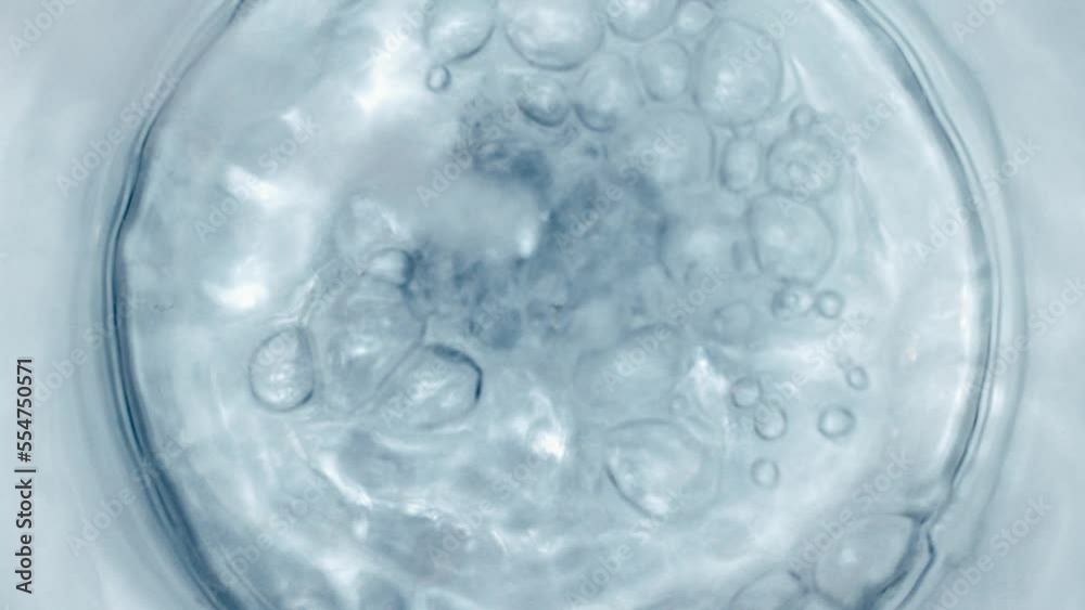 Pure Water Poured Into Glass closeup on light gray background. Super slow motion. Quenching thirst concept. Clear fresh drinking water filling glass close up Pure Water Poured Into Glass closeup on light gray background. Super slow motion. Quenching thirst concept. Clear fresh drinking water filling glass close up