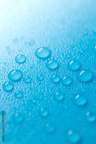  drops on a blue background with white gradient.Fluid texture in cold blue tones.Wallpaper blau phone.macro drops set.Water drops background.