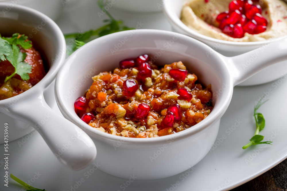 adjika Turkish cuisine on white plate macro close up adjika Turkish cuisine on white plate macro close up