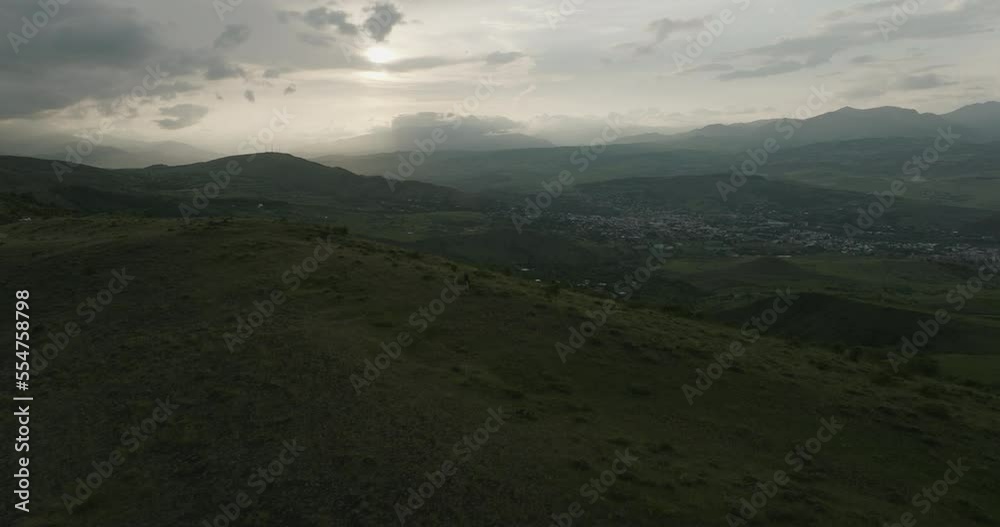 Aerial View Of Rural Village Against Cloudy Sky In Samtskhe-Javakheti, Near Akhaltsikhe In Georgia - drone shot Aerial View Of Rural Village Against Cloudy Sky In Samtskhe-Javakheti, Near Akhaltsikhe In Georgia - drone shot