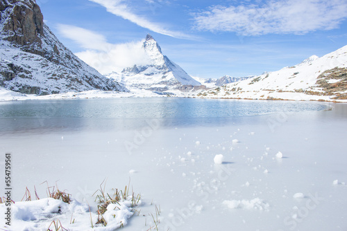 Matterhorn Peak with Rifflesee Lake foreground in Winter. photo