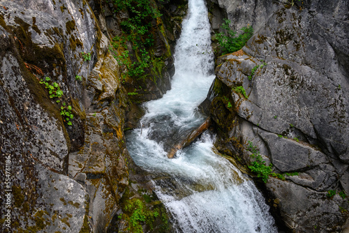 Christine Falls flowing through a rocky cliff face in Mt. Rainier National Park
 photo