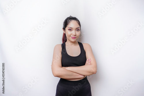 Shot of a sporty young confident woman posing against a white background.