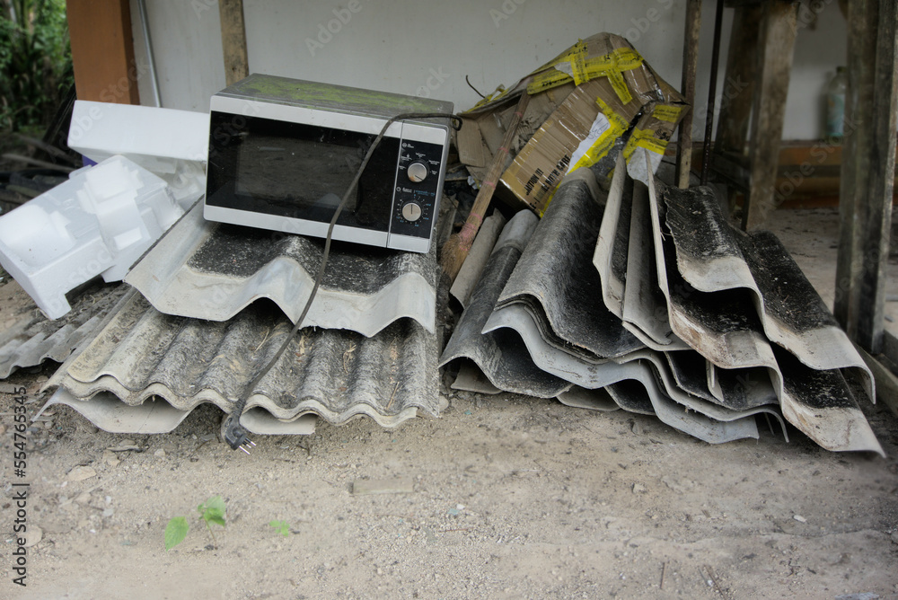 Garbage Pile, Piles of old gray concrete roof tiles. Building debris. E
