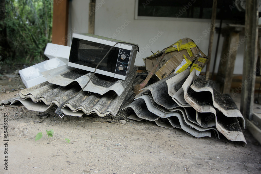 Garbage Pile, Piles of old gray concrete roof tiles. Building debris. E
