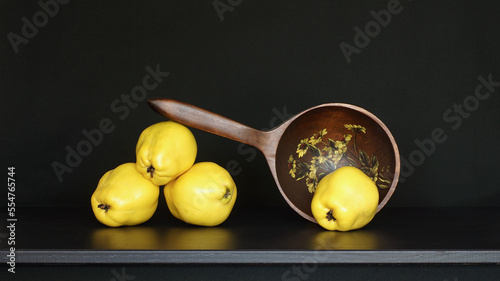 Quince with a wooden Spoon