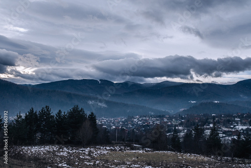 Carpathian mountains in the clouds on a winter evening