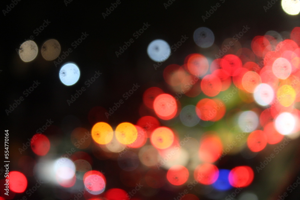 Blurred vehicle lights in a traffic jam in the city on a dark night.  suitable for abstract blur theme