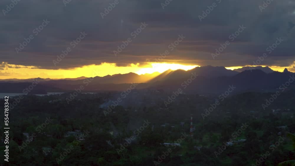 Last moments of a bright golden sunset at dusk before darkness creeps over the mountainside. Last moments of a bright golden sunset at dusk before darkness creeps over the mountainside.