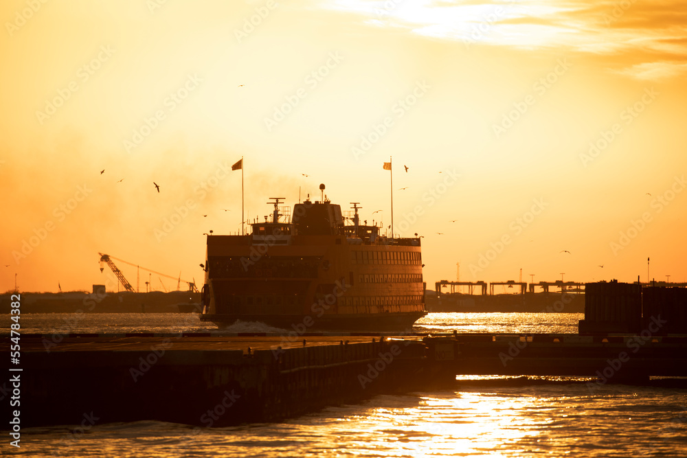 Staten Island ferry boat during sunset in NYC