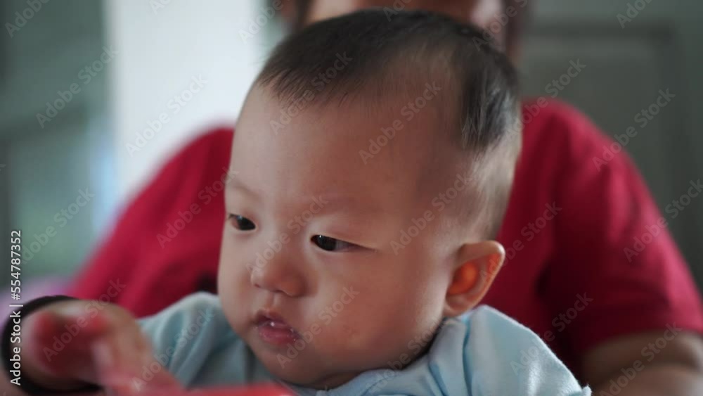 Close up the face of drop drool. Grandmother clean with hand