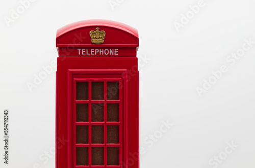 Red London Street Phone Booth Isolated on White Background.