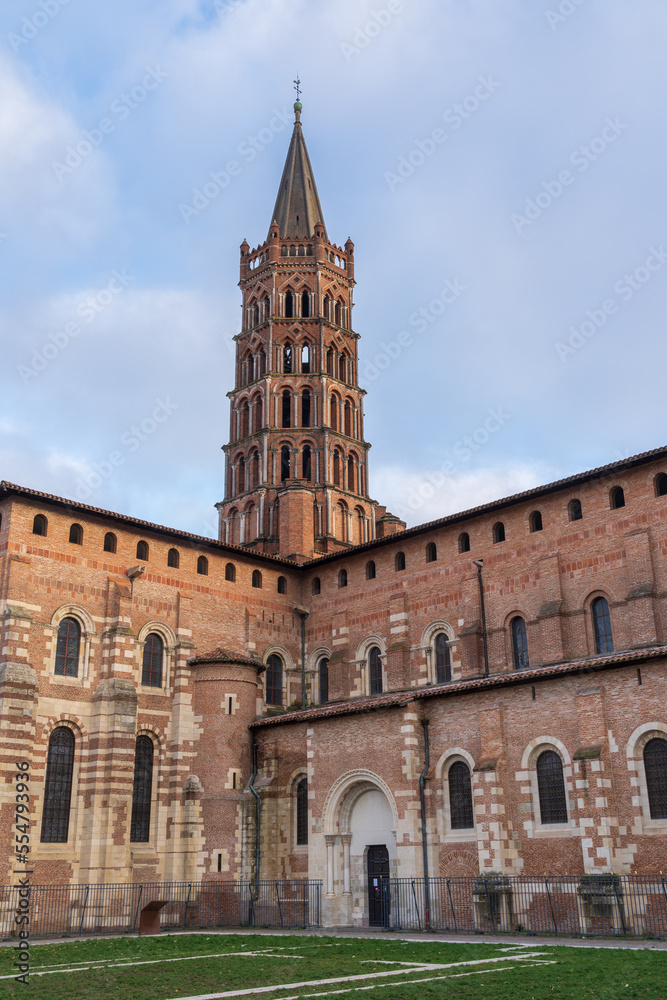Scenic vertical landscape view of ancient landmark St Sernin basilica in the pink city of Toulouse, France