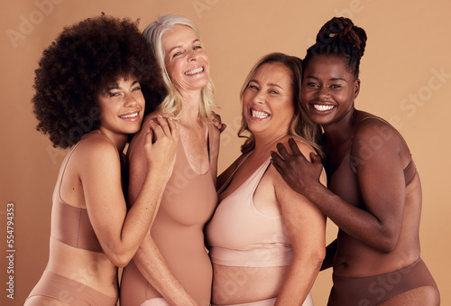 Diversity, happy and women with natural beauty, skincare and cosmetics together on studio background. Portrait group of female models in underwear for wellness, real body positivity and self love photo