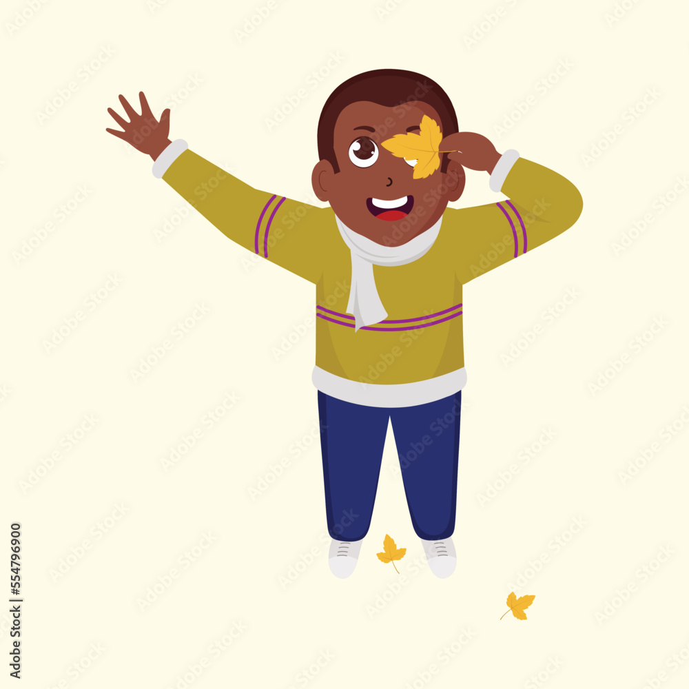 Cheerful Boy Covering One Eye With An Autumn Leaf On Beige Background. Cheerful Boy Covering One Eye With An Autumn Leaf On Beige Background.