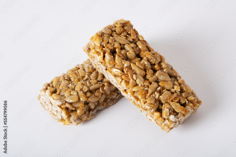 Kozinak from sunflower seeds on a white background. Traditional Georgian sweetness Kozinak from sunflower seeds on a white background. Traditional Georgian sweetness