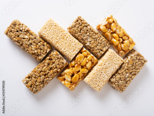 Pattern of different types of Georgian traditional kozinak sweetness on a white background.