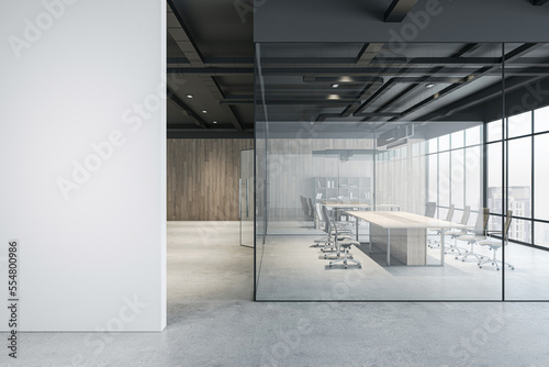 Tablou canvas Front view on light grey wall in modern interior design office hall with conference room behind glass partitions, wooden walls background and city view from panoramic window