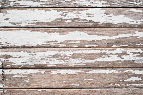 Wooden background  old painted boards  with old peeling white paint. Idea for wallpaper or screensaver