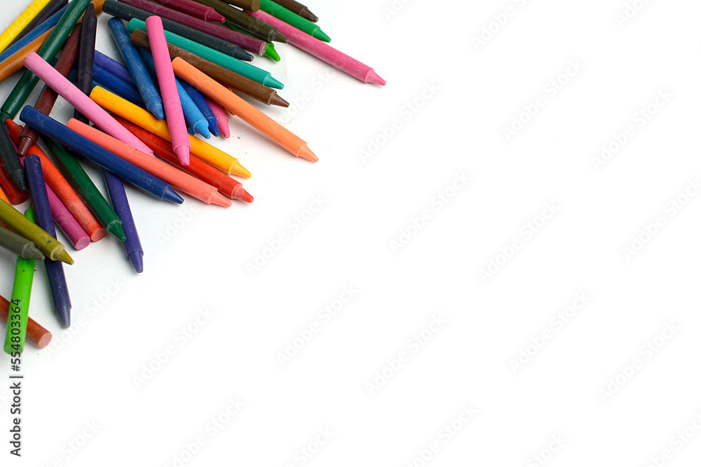 Fototapeta premium Crayons lined up isolated on white background.